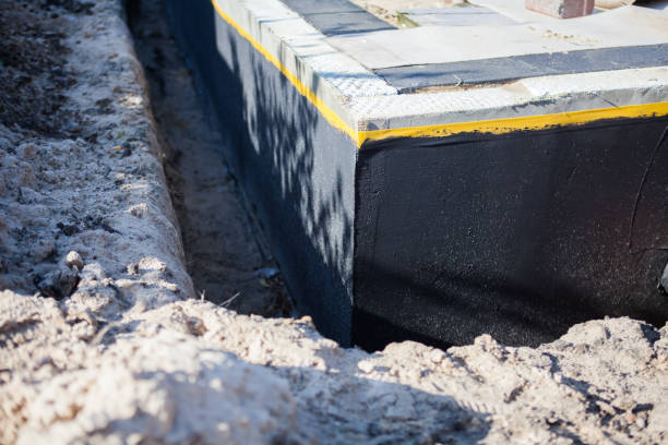 Professional Waterproofing technician working in Alexandria, KY